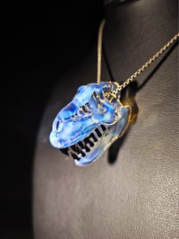 Image 2 of Mini moonstone T-rex skull pendant. 