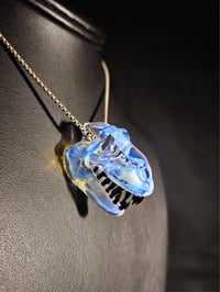 Image 3 of Mini moonstone T-rex skull pendant. 