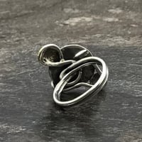 Image 2 of Silver ring with obsidian stone and brass.