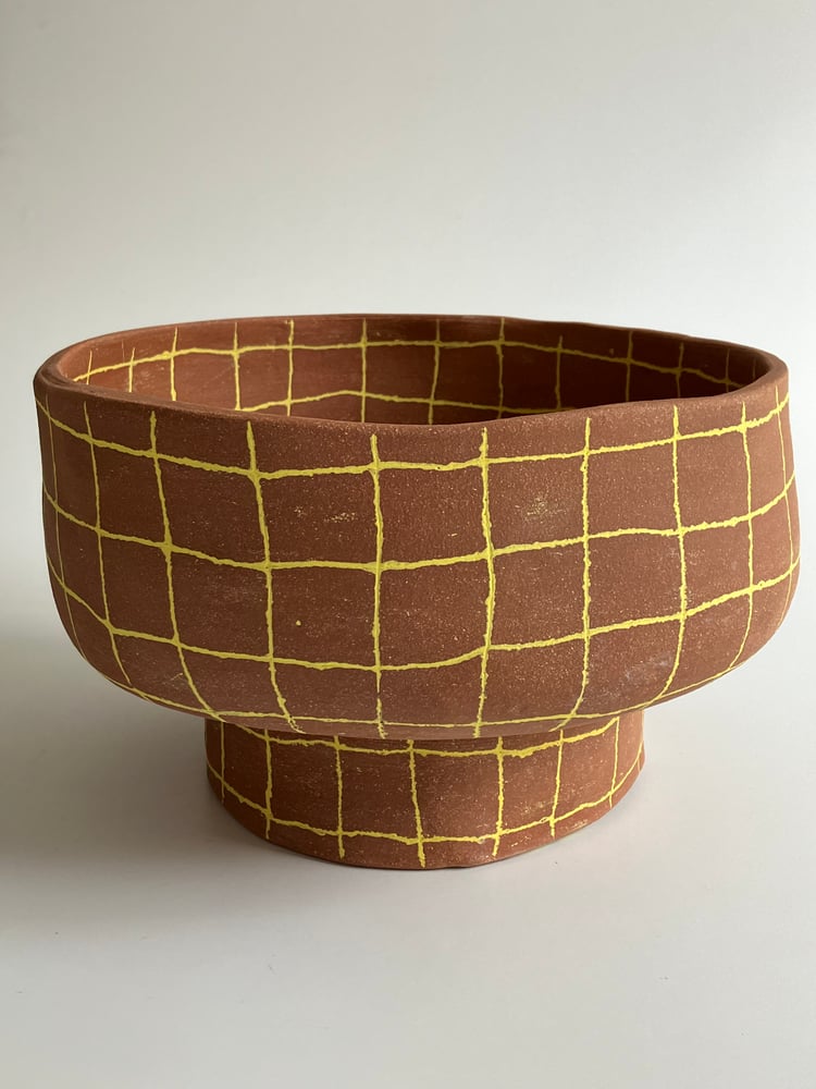 Image of yellow grid footed bowl