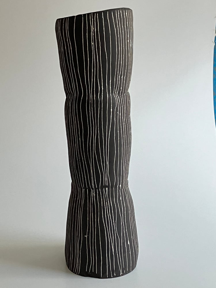 Image of tall black stoneware vessel