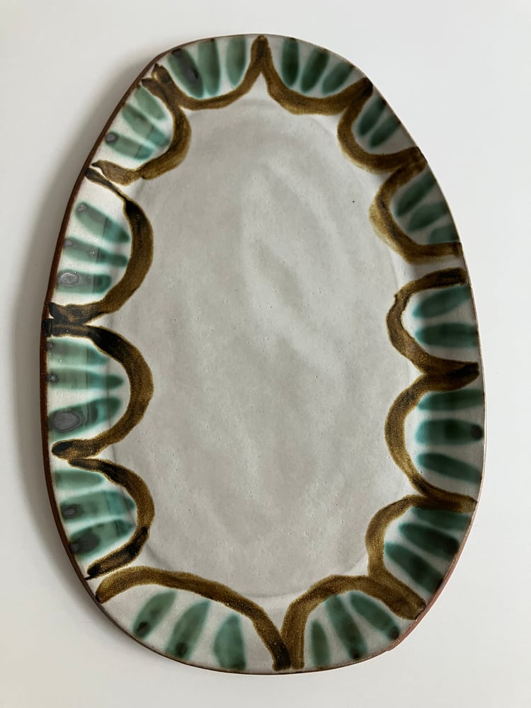 Image of large scalloped stoneware platter