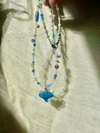 Image 2 of baby spiral angel stingray necklace