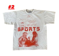 Image 2 of red ink SPORTS on worn in shirt. front and back.