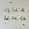 glass flower with green leaf huggie hoop earrings