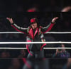 RING WORN BLACK & RED STUDDED JACKET FROM MICKIE JAMES HER AUSTRALIA EVENT