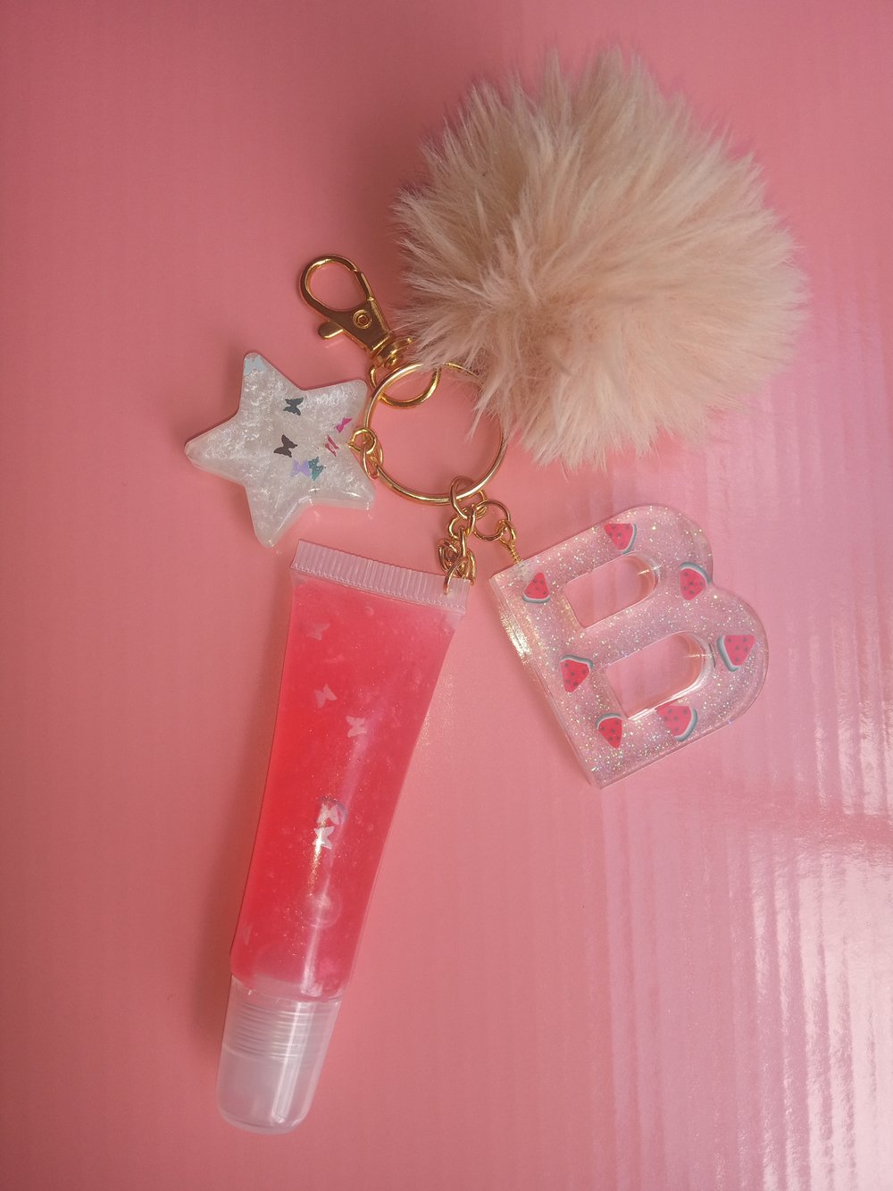 Image of Lipgloss initial keychain (Clear with fruit slices)