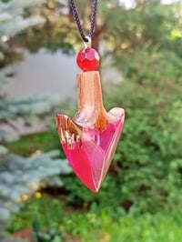 Image 2 of The arrowhead is made of epoxy resin and wood