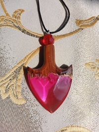 Image 3 of The arrowhead is made of epoxy resin and wood