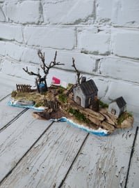 Image 1 of Driftwood. House by the river