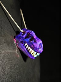 Image 2 of  Royal jelly T-rex skull pendant. (Mini)