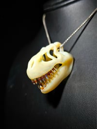 Image 1 of Wood glue T-rex skull pendant. (Mini)