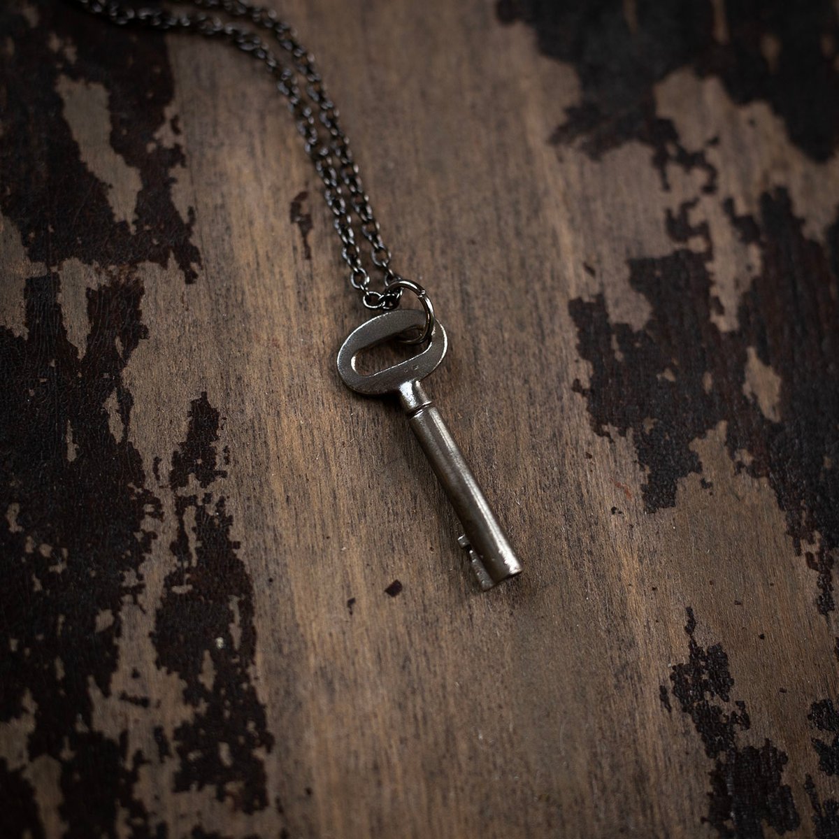 Small oval skeleton key necklace on gunmetal chain