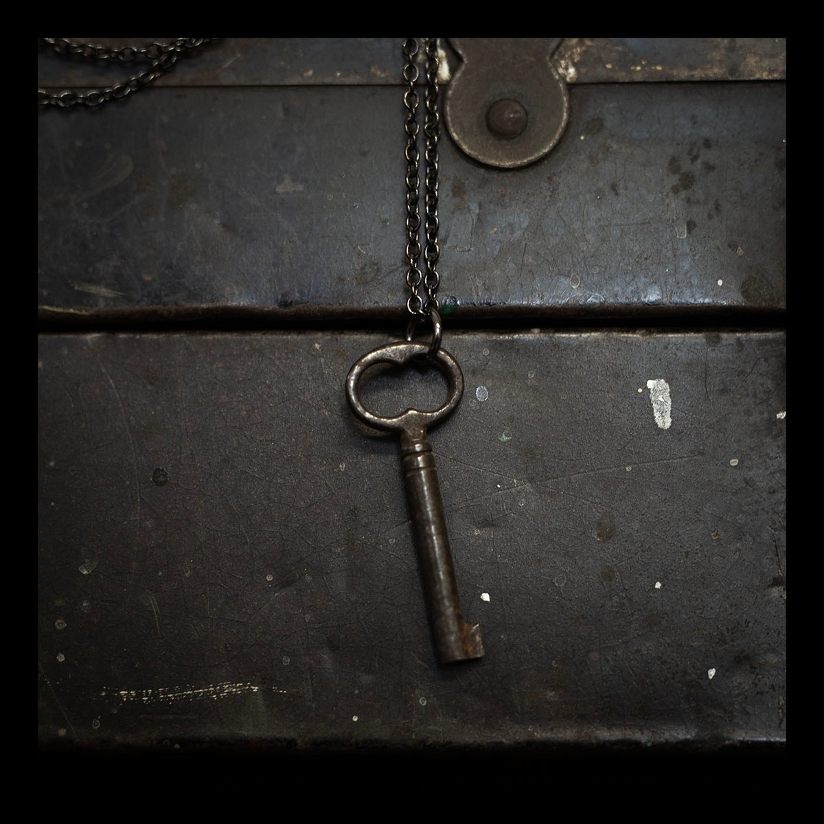 Dark skeleton key on gunmetal chain