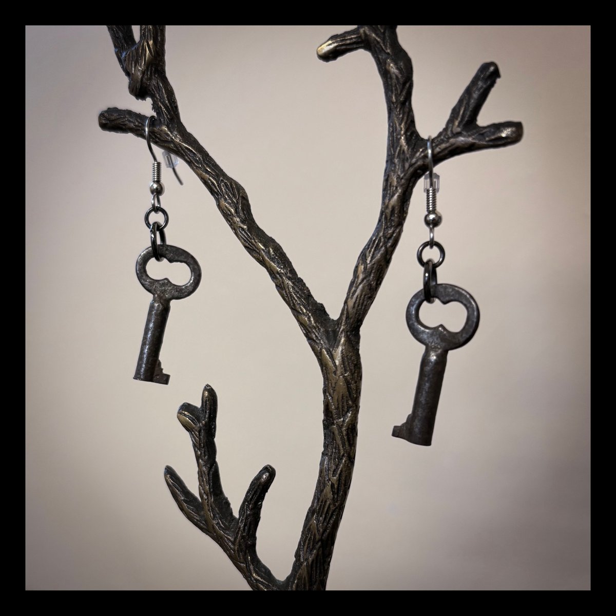 Tiny key earrings on surgical steel hooks
