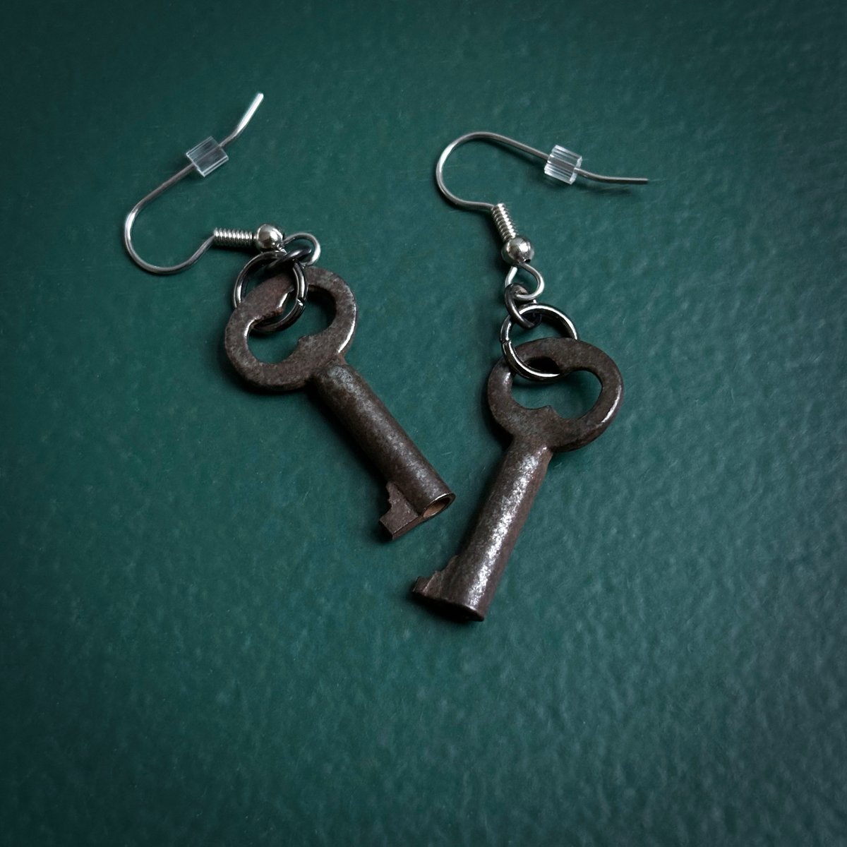 Tiny key earrings on surgical steel hooks