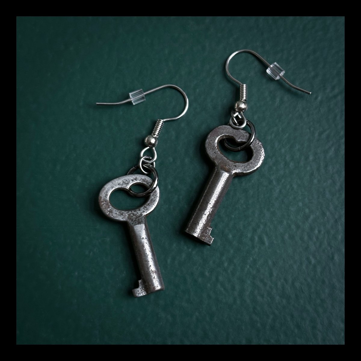 Tiny Heart-Shaped key earrings on surgical steel hooks