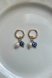 Image 2 of 18k gold Evil Eye Pearl Huggies