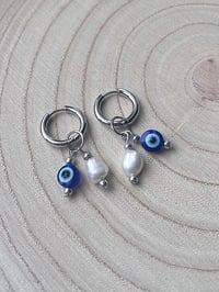 Image 1 of Stainless Steel Evil Eye Huggies