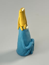 Image 4 of Yellow thing sat on a blue thing