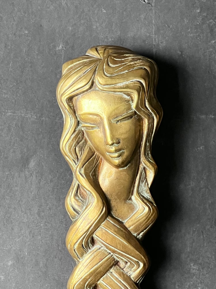 Image of Pair of Door Handles in the form of a Woman's Face with Braided Hair