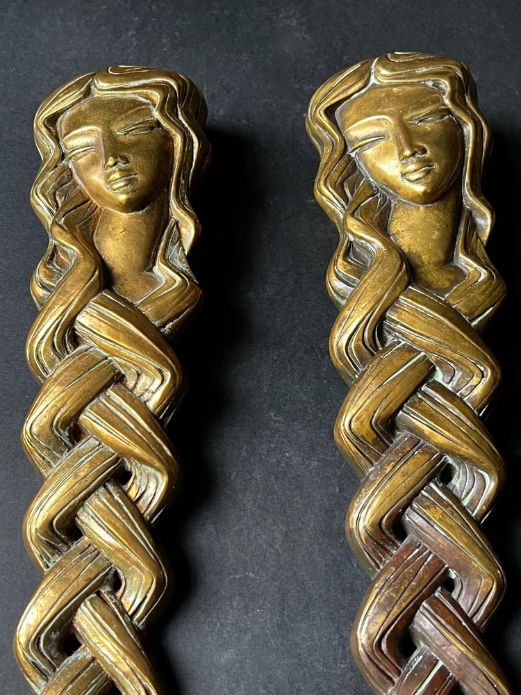 Image of Pair of Door Handles in the form of a Woman's Face with Braided Hair