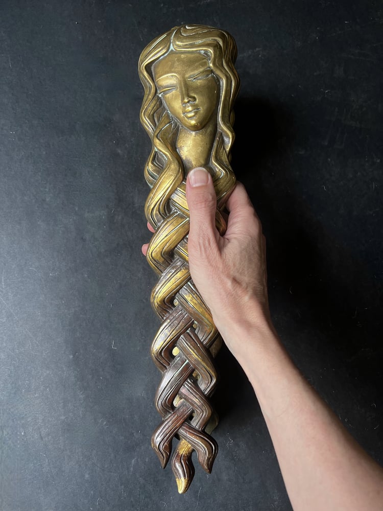 Image of Pair of Door Handles in the form of a Woman's Face with Braided Hair