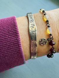 Image 1 of Ethiopian opal, pearl, and garnet charm bracelet