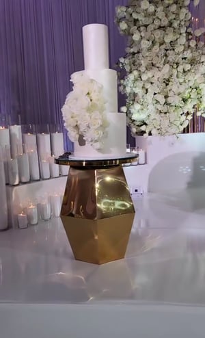 Image of Gold stainless steel wedding cake stand glass top