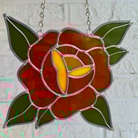 Image 1 of opaque orange rose