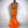 Orange Velvet sleevless mermaid gown with rhinestone and beaded applique and illusion mesh.