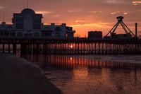 Sun rising under South Parade Pier