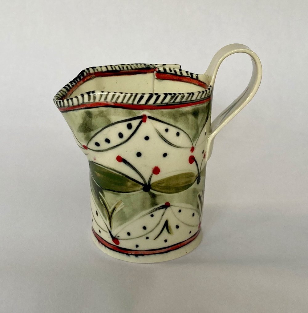 Image of Dish and Jug green spotted leaves pattern.