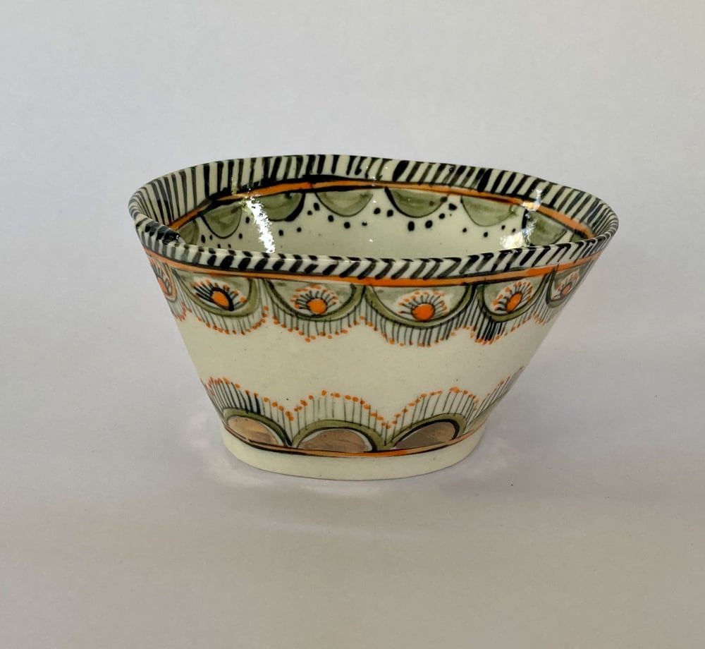 Image of Two small bowls  blue and orange with gold