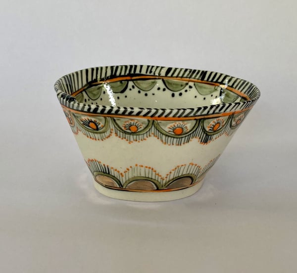 Image of Two small bowls  blue and orange with gold