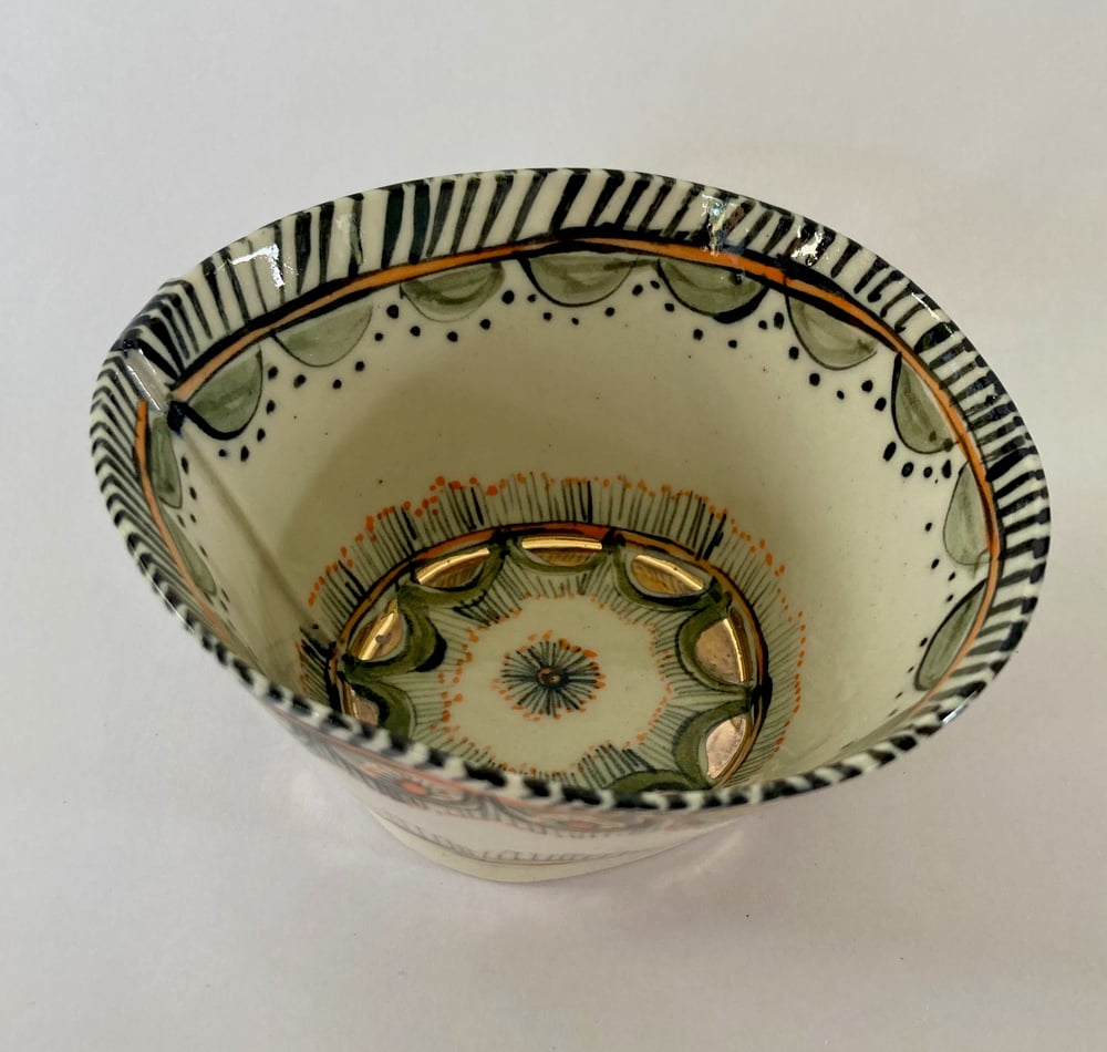Image of Two small bowls  blue and orange with gold