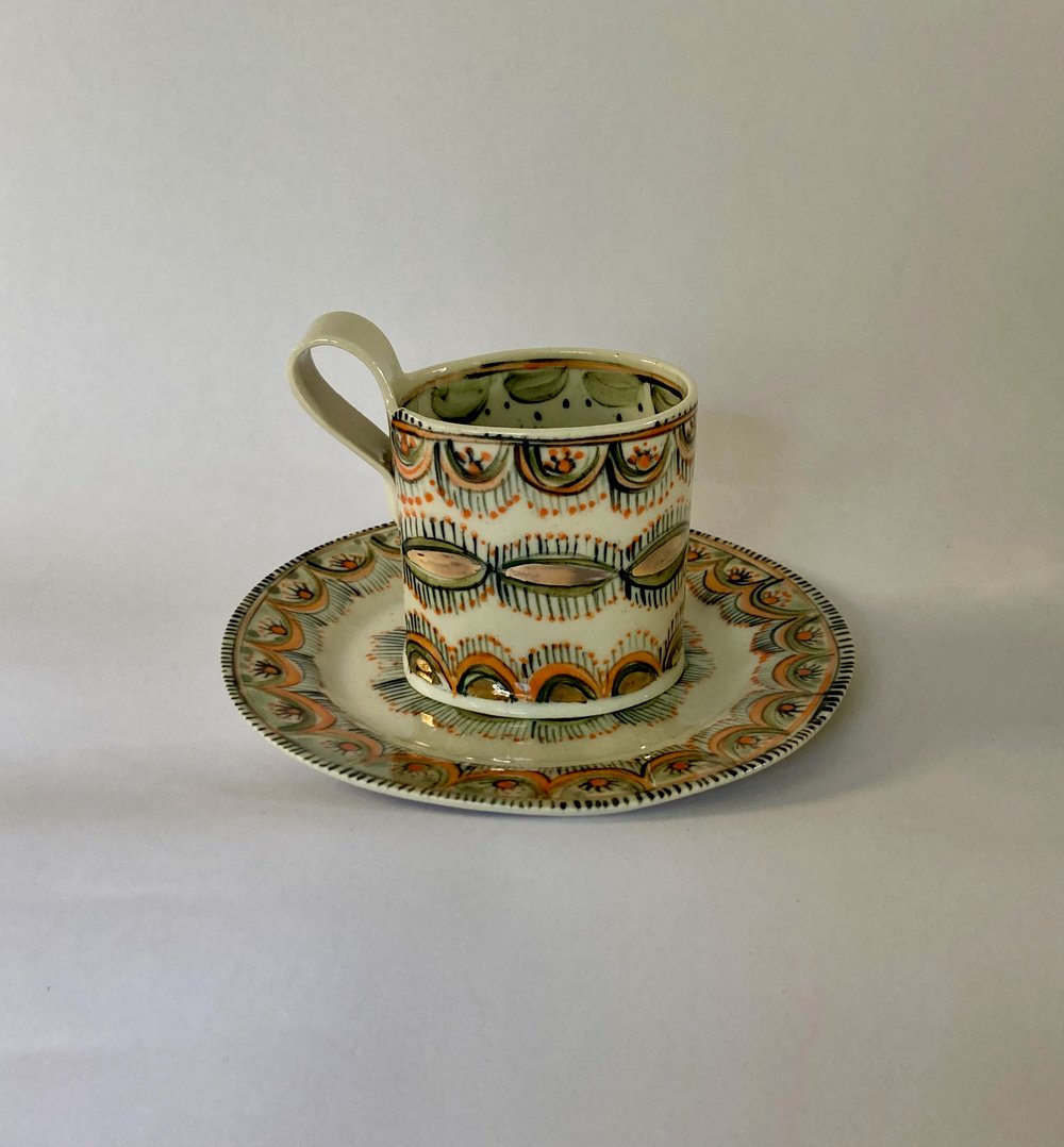 Image of Coffee cups orange and gold