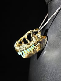 Image 3 of Electrum T-rex skull pendant with wood glue teeth.