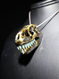 Image 4 of Electrum T-rex skull pendant with wood glue teeth.