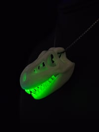 Image 3 of White T-rex skull pendant with illuminati teeth (uv reactive) 