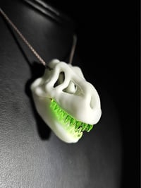 Image 1 of White T-rex skull pendant with illuminati teeth (uv reactive) 