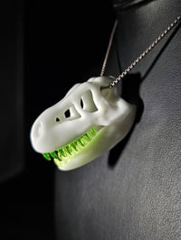 Image 2 of White T-rex skull pendant with illuminati teeth (uv reactive) 