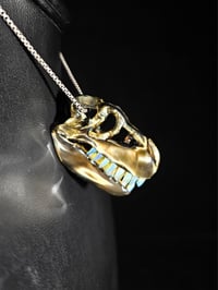 Image 4 of Electrum T-rex skull pendant with wood glue teeth..