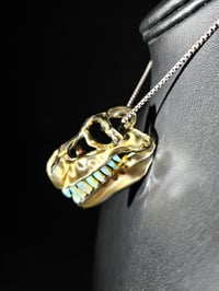 Image 3 of Electrum T-rex skull pendant with wood glue teeth..