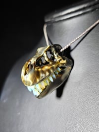 Image 1 of Electrum T-rex skull pendant with wood glue teeth..