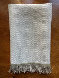Image 1 of Handwoven linen tea towel with fringe in m’s and o’s