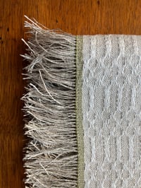 Image 3 of Handwoven linen tea towel with fringe in m’s and o’s