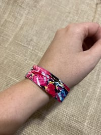 Image 2 of Bright pink, thin aluminium cuff bracelet.