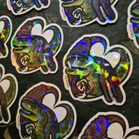 Image 1 of Frenemies - Tyrannosaurus & Spinosaurus love dinosaur die-cut holographic vinyl sticker
