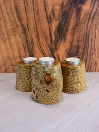 Image 1 of Set of three Spruce wood tea light candle holders with natural markings